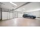 Expansive three-car garage with an epoxy floor, multiple doors, and ample space for vehicles and storage at 4921 Slaton Dr, Acworth, GA 30101