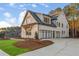 Spacious three-car garage with modern glass doors, offering ample parking and curb appeal to this well-maintained home at 4921 Slaton Dr, Acworth, GA 30101