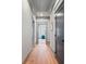 Hallway featuring hardwood floors, elegant trim work, and access to other rooms, creating a seamless flow at 4921 Slaton Dr, Acworth, GA 30101