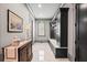 Elegant hallway featuring custom mudroom-style built-ins, marble tile flooring, and sophisticated trim work at 4921 Slaton Dr, Acworth, GA 30101