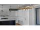 Stylish kitchen with white cabinetry, quartz countertops, and gold lighting at 4921 Slaton Dr, Acworth, GA 30101
