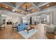 Open-concept living room with decorative ceilings, hardwood floors, and elegant furnishings at 4921 Slaton Dr, Acworth, GA 30101
