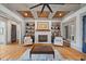 Inviting living room with fireplace, built-in shelves, and coffered wood ceiling at 4921 Slaton Dr, Acworth, GA 30101