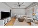 Bright living room features hardwood floors, comfortable furniture, and plenty of natural light at 4921 Slaton Dr, Acworth, GA 30101