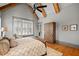 Bright main bedroom featuring vaulted ceilings, sitting area, and hardwood floors at 4921 Slaton Dr, Acworth, GA 30101