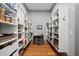 Organized pantry with shelving, table, and ample storage space for kitchen goods at 4921 Slaton Dr, Acworth, GA 30101