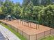 A view of a charming playground with swings, slides, and picnic tables, perfect for outdoor fun at 4921 Slaton Dr, Acworth, GA 30101