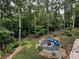 Backyard firepit encircled by Adirondack chairs at 197 Saddleridge Dr, Bremen, GA 30110