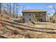 Spacious backyard features a seating area, fire pit, and deck, all ideal for outdoor gatherings at 197 Saddleridge Dr, Bremen, GA 30110