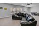 Finished basement featuring a large seating area, neutral carpet, windows, and a ceiling fan at 197 Saddleridge Dr, Bremen, GA 30110