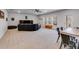 Finished basement featuring a large seating area, neutral carpet, and a ceiling fan at 197 Saddleridge Dr, Bremen, GA 30110