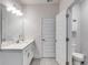 Stylish bathroom with a granite vanity, a large mirror, and a door to the water closet at 197 Saddleridge Dr, Bremen, GA 30110