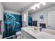 Modern bathroom featuring a white vanity, quartz countertops, a shower/tub with a designer curtain, and sleek fixtures at 197 Saddleridge Dr, Bremen, GA 30110
