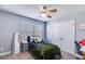 Comfortable bedroom with closet, large mirror, natural light, and neutral tones at 197 Saddleridge Dr, Bremen, GA 30110