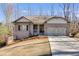 Charming brick home with two-car garage, front porch, and well-maintained lawn, perfect for a growing Gathering at 197 Saddleridge Dr, Bremen, GA 30110