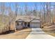 Beautiful brick home with attached garage, offering modern comfort and curb appeal, surrounded by mature trees at 197 Saddleridge Dr, Bremen, GA 30110