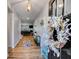 Welcoming foyer with wood flooring, adorned with a wreath and bench, leading into a cozy living space at 197 Saddleridge Dr, Bremen, GA 30110