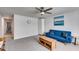 Spacious living room with modern design, a blue couch, a ceiling fan, and an abundance of natural light at 197 Saddleridge Dr, Bremen, GA 30110