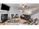 Open-concept living room with fireplace, comfortable seating, and staircase, perfect for modern living at 197 Saddleridge Dr, Bremen, GA 30110