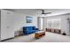 Inviting living room with modern decor, a blue couch, bright windows, and a ceiling fan at 197 Saddleridge Dr, Bremen, GA 30110