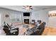 Cozy living room with modern decor, fireplace, and ceiling fan, creating a relaxing atmosphere for entertaining at 197 Saddleridge Dr, Bremen, GA 30110