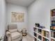 Serene reading room with a plush chair, world map, and bookshelves filled with books at 197 Saddleridge Dr, Bremen, GA 30110