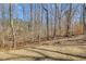 Image features backyard surrounded by trees at 197 Saddleridge Dr, Bremen, GA 30110