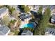 Aerial view showcases a community pool and clubhouse nestled among the residential buildings at 3540 Chattahoochee Summit Se Ln # 28, Atlanta, GA 30339