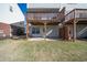 Exterior view of backyard featuring deck with stairs leading to patio at 3540 Chattahoochee Summit Se Ln # 28, Atlanta, GA 30339