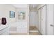 Bright bathroom features a soaking tub under a window and a separate glass-door shower at 3540 Chattahoochee Summit Se Ln # 28, Atlanta, GA 30339