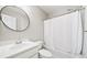Clean bathroom features white vanity, toilet, and shower-tub combo at 3540 Chattahoochee Summit Se Ln # 28, Atlanta, GA 30339