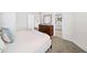 Bedroom with neutral tones, carpet, and a view into the ensuite bathroom at 3540 Chattahoochee Summit Se Ln # 28, Atlanta, GA 30339