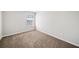 Neutral bedroom showcases soft carpet and a sunlit window at 3540 Chattahoochee Summit Se Ln # 28, Atlanta, GA 30339