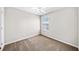 Cozy bedroom showcasing neutral walls and carpet, complemented by natural light at 3540 Chattahoochee Summit Se Ln # 28, Atlanta, GA 30339