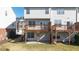 Exterior view featuring multiple back decks with stairs leading to yard at 3540 Chattahoochee Summit Se Ln # 28, Atlanta, GA 30339