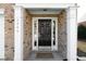 Inviting front entrance with classic black door and decorative sidelights at 3540 Chattahoochee Summit Se Ln # 28, Atlanta, GA 30339