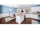 Open concept kitchen with stainless steel appliances, hardwood floors, view to dining area at 3540 Chattahoochee Summit Se Ln # 28, Atlanta, GA 30339