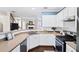 Well-lit kitchen with white cabinetry, stainless steel appliances, and a view into the adjacent living space at 3540 Chattahoochee Summit Se Ln # 28, Atlanta, GA 30339