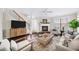 Cozy living room with fireplace, ceiling fan, and lots of natural light at 3540 Chattahoochee Summit Se Ln # 28, Atlanta, GA 30339
