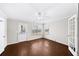 Bright living room boasts hardwood floors, large windows, and a glass door at 3540 Chattahoochee Summit Se Ln # 28, Atlanta, GA 30339