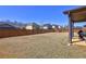 A spacious backyard with a wood privacy fence and a covered patio, ideal for entertaining at 60 Streamside Dr, Covington, GA 30016