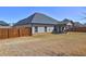 Property showcasing a spacious, fenced backyard with a covered patio, ideal for outdoor living at 60 Streamside Dr, Covington, GA 30016