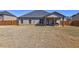 Backyard features a covered porch, wood fence, and a spacious backyard at 60 Streamside Dr, Covington, GA 30016