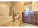 Traditional bathroom featuring a shower-tub combination, toilet, and a dark wood vanity with a marble countertop at 60 Streamside Dr, Covington, GA 30016