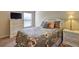 Bright bedroom with a large window, comfortable bed, and accent furniture at 60 Streamside Dr, Covington, GA 30016