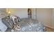 Comfortable bedroom showing entry to a kitchen with soft, decorative pillows at 60 Streamside Dr, Covington, GA 30016
