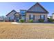 Charming brick and siding home with manicured lawn, complemented by lush green bushes at 60 Streamside Dr, Covington, GA 30016