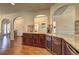 Spacious kitchen with dark wood cabinets, granite countertops, and stainless steel appliances at 60 Streamside Dr, Covington, GA 30016