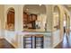 Kitchen with granite counters and open view to dining area and walkway at 60 Streamside Dr, Covington, GA 30016