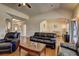Spacious open-concept living room with hardwood floors and elegant archways at 60 Streamside Dr, Covington, GA 30016